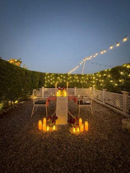Semi Private Candlelight Dinner in Mohali with candles, fairy lights and romantic table decoration